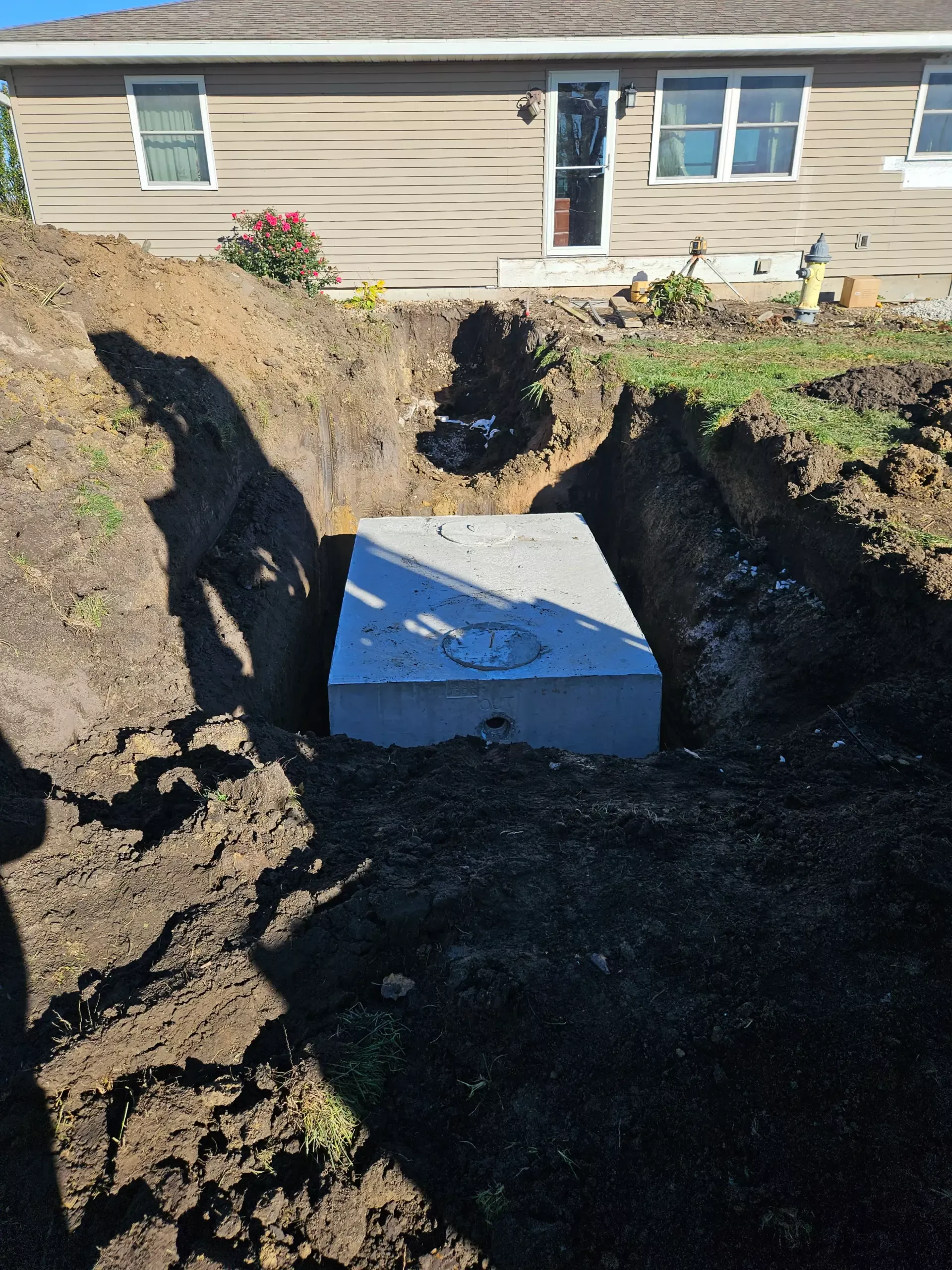 Full-color photograph of a septic installation by Hamilton Concrete Products in Hamilton, Illinois.